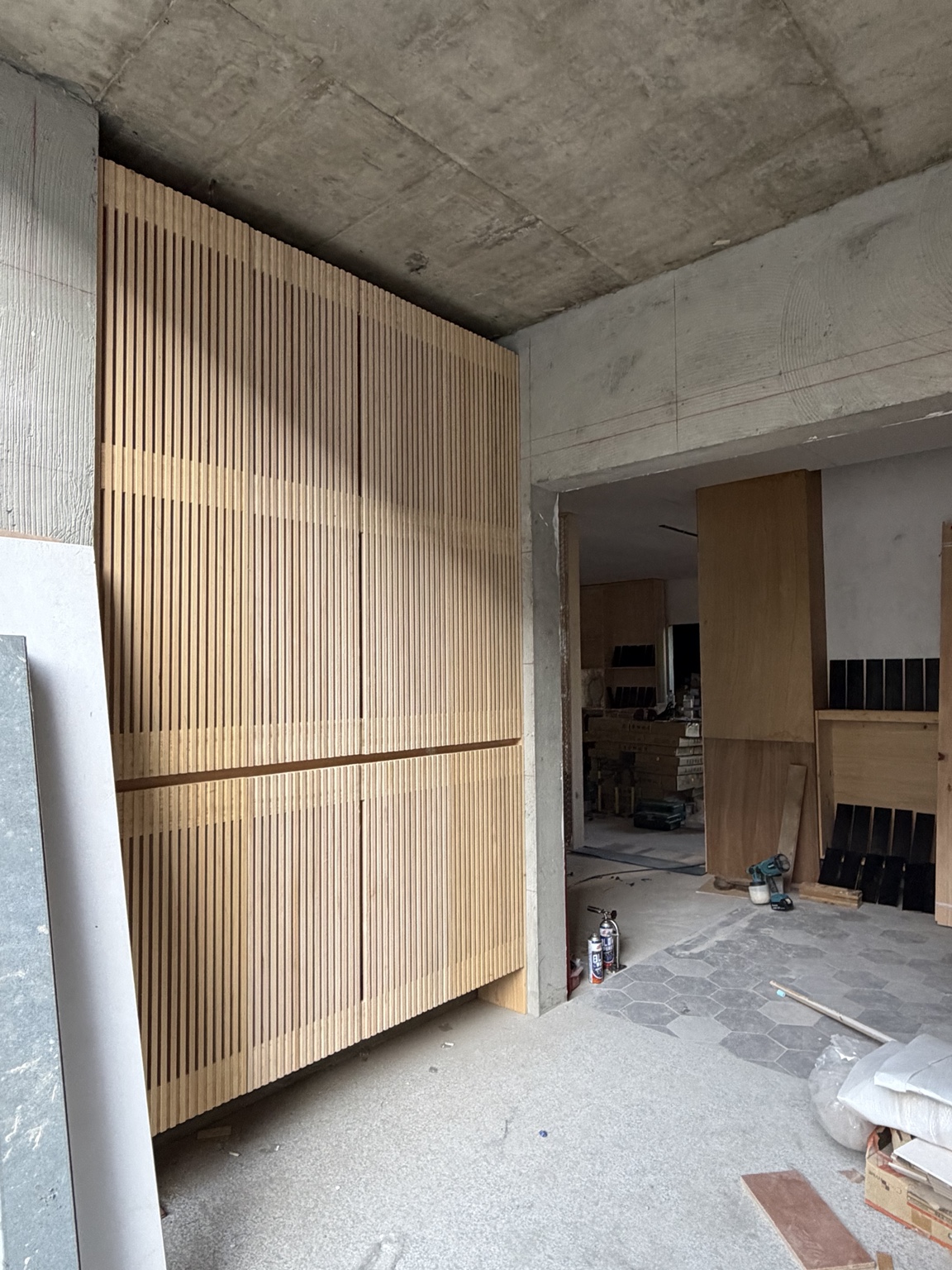 Large vertical timber lattice wall under construction